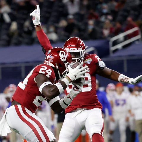 Oklahoma linebacker Brian Asamoah (24) makes an in