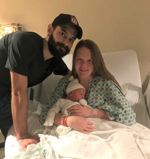 Parents Charlie and Cassandra Dalton hold Rylan Dalton, 2021’s first baby born early Friday morning at Adena Regional Medical Center.