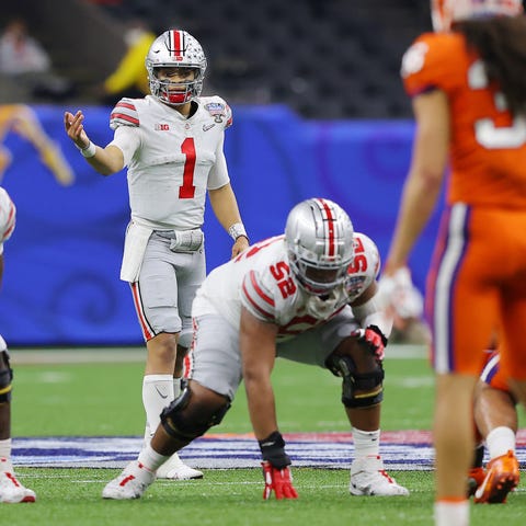 Ohio State quarterback Justin Fields looks on befo