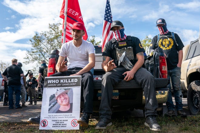 Proud Boys flash the OK hand signal, a gesture often associated with far-right groups, during a Proud Boy rally on September 26, 2020 in Portland, Oregon. (Nathan Howard/Getty Images/TNS)