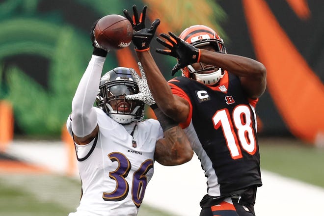 Baltimore Ravens strong safety Chuck Clark (36) breaks up a pass intended for Cincinnati Bengals wide receiver A.J. Green (18) during the second half of an NFL football game, Sunday, Jan. 3, 2021, in Cincinnati. (AP Photo/Aaron Doster)