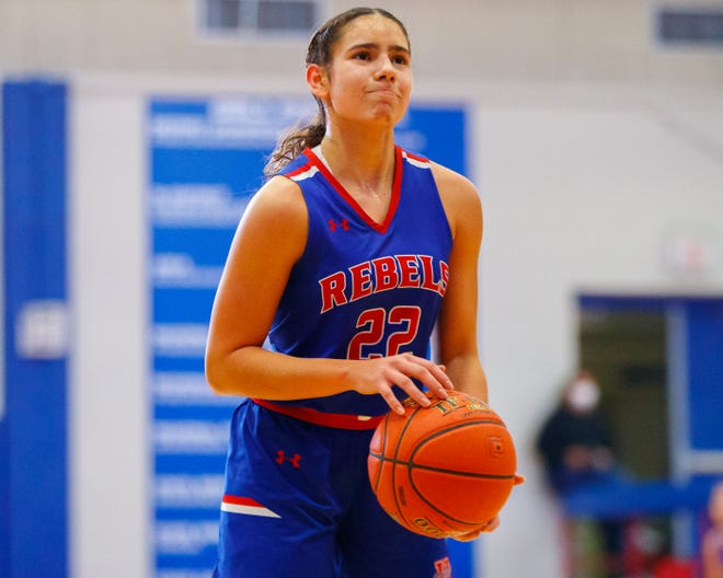 Hays point guard Jivana Caceres, shooting a free throw against Westlake last month, is playing her first season of high school basketball. She moved to Texas from Puerto Rico when she was 11.