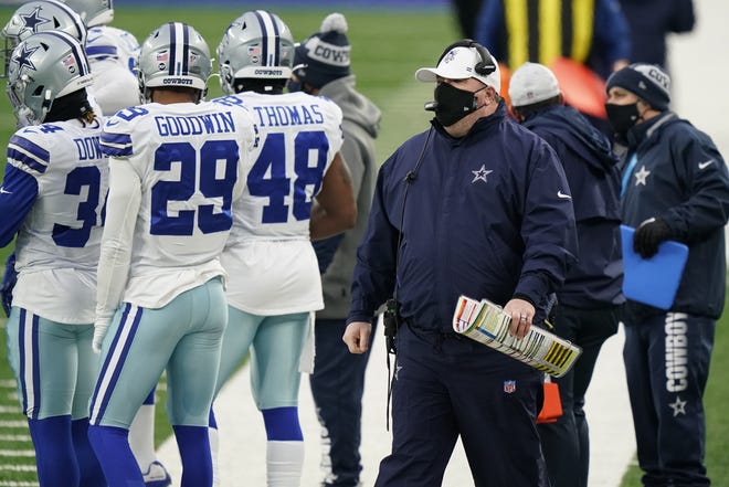 Dallas coach Mike McCarthy surveys the field during the Cowboys' 23-19 loss to the New York Giants on Sunday. McCarthy didn't challenge a catch that set up a late Giants field goal though it appeared to hit the ground.