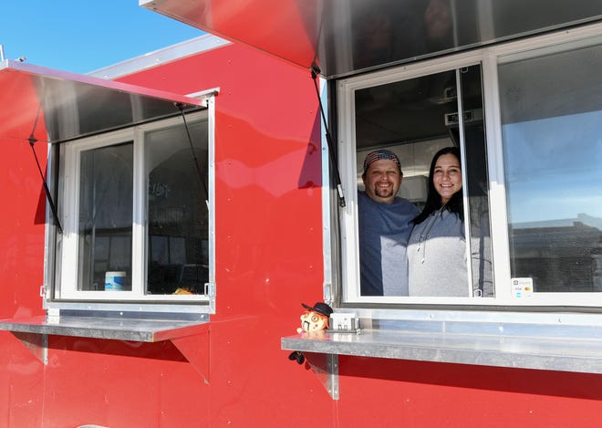 Ken and Calain Leonard stand inside their new food truck, Tacos de Gringo, on Saturday, January 2, in Brandon.