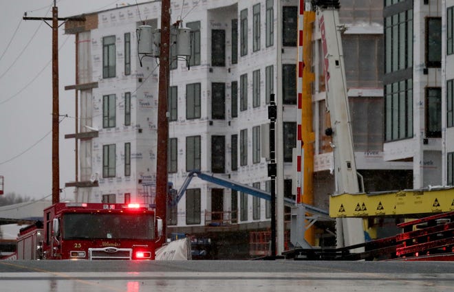 Emergency crews work on the scene of a reported explosion at the new River 1 mixed-use project at West Becher and South First streets in Milwaukee on Dec. 12.