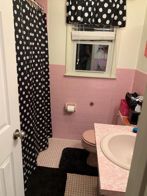 Michelle Amaducci spruced up the pink bathroom with polka dots. Photo: provided.