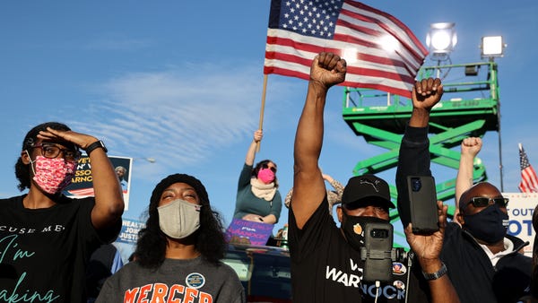 Voters listen as democratic candidate for U.S. Sen