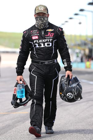 Jeffrey Earnhardt, driver of the No. 0 JD Motorsports Chevrolet, walks the grid prior to the NASCAR Xfinity Series Kansas Lottery 250 at Kansas Speedway on July 25, 2020 in Kansas City, Kansas.