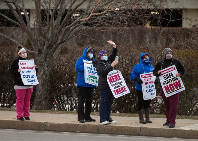 Nurses picket for safe working conditions Wednesday outside St. Vincent Hospital.