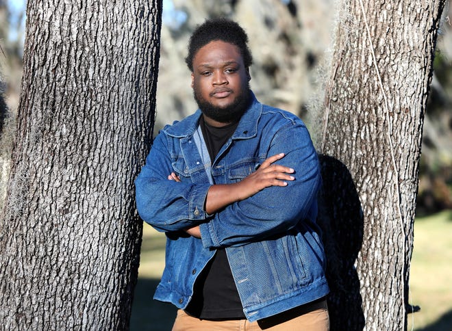 Jordan Washington, a Santa Fe College performing arts student who has been furloughed from his part time position at the Phillips Center for the Performing Arts due to the COVID-19 pandemic closing theaters in the area, poses for a photo outside his apartment, in Gainesville Jan. 5, 2020.