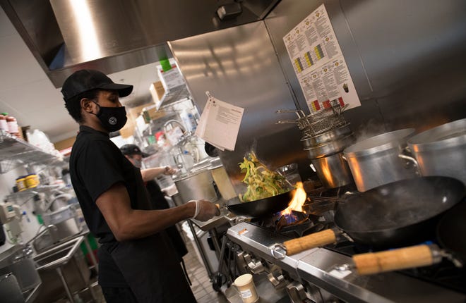 Chef Zeek Williams of Lindenwold cooks in the kitchen of Teriyaki Madness in Marlton.