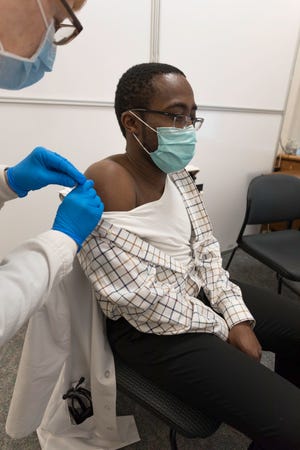 Dr. Richard Amankwah, a Prevea Health hospitalist at St. Vincent Hospital and St. Mary’s Hospital Medical Center, was one of the first people to receive a dose of a COVID-19 vaccine in Green Bay.