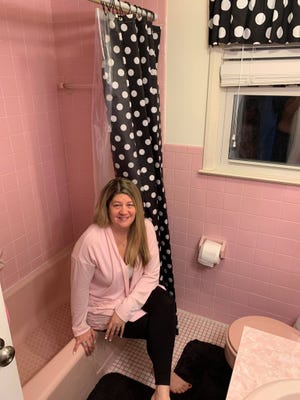 Michelle Amaducci of Succasunna dresses up her vintage pink bathroom with polka dot accessories. "I did my best to modernize the look without having to redo the entire room," she said.