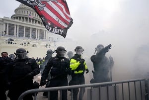 Police try to hold off Trump supporters who tried to break through a police barrier on Jan. 6, 2021, at the Capitol in Washington, D.C.