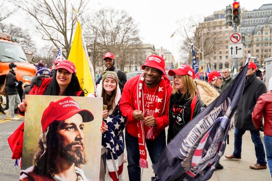 Protestors take a photo with rapper Bryson Gray, from High Point, NC during protests in Washington, DC on Jan. 6, 2021.