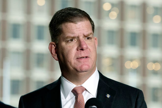 In this March 13, 2020, file photo, Boston Mayor Marty Walsh talks about the postponement of the Boston Marathon during a news conference in Boston. He is now the U.S. labor secretary.