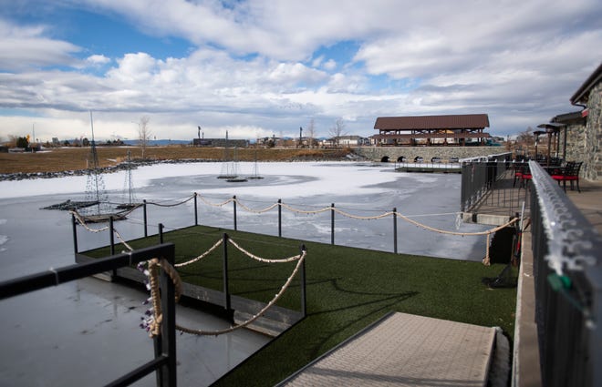 In this file photo, ice covers the pond in front of Ted's Grill at RainDance in Windsor on Jan. 5, 2021.
