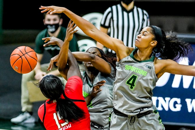 Michigan State's Alisia Smith, right, and teammate Mardrekia Cook, center, pressure Maryland's Ashley Owusu during the first quarter on Thursday, Jan. 7, 2021, at the Breslin Center in East Lansing. 