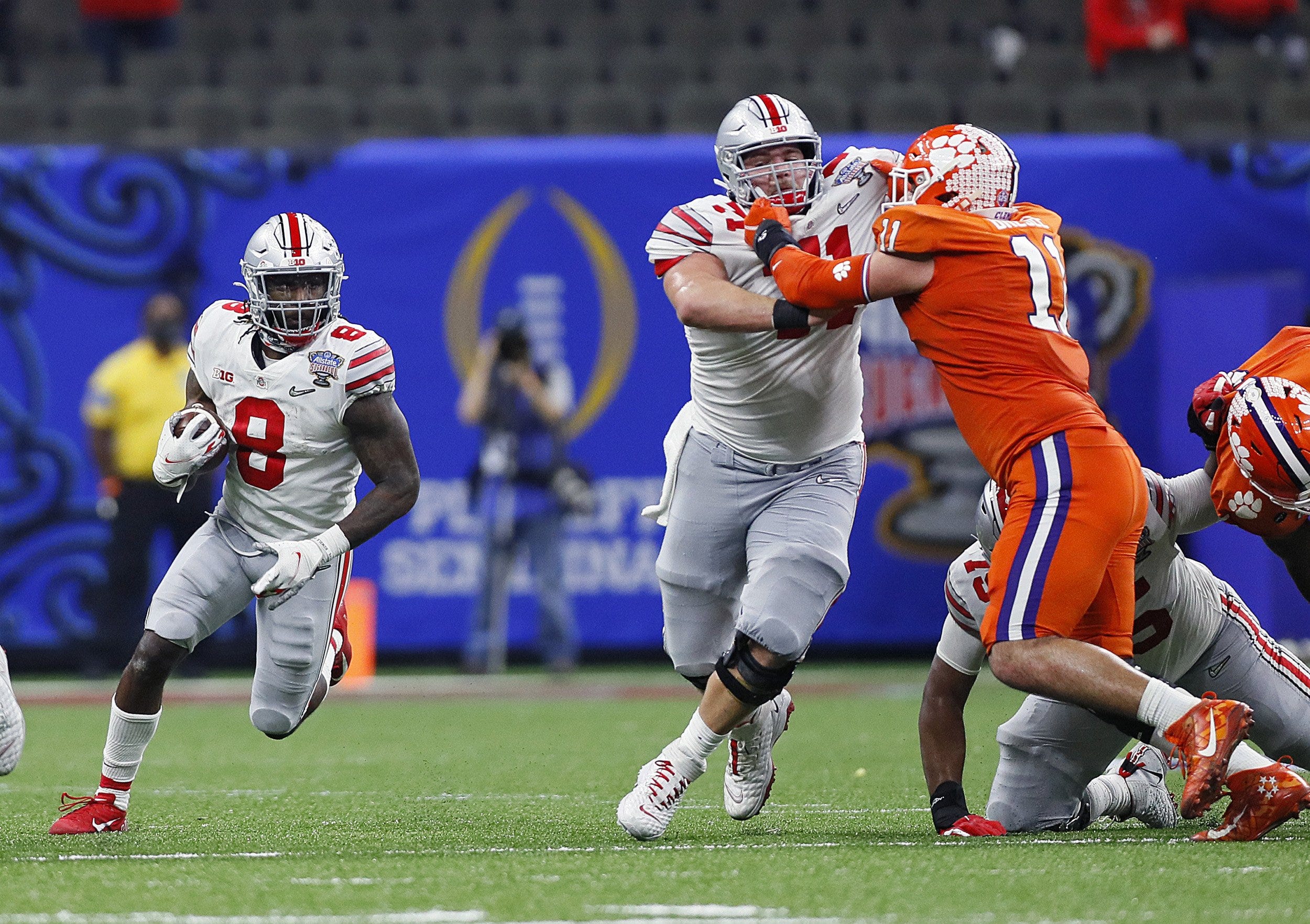 Ohio State Buckeyes offensive lineman Josh Myers (71) blocks Clemson Tigers defensive lineman Bryan Bresee (11) on a running play for running back Trey Sermon (8) during the College Football Playoff semifinal at the Allstate Sugar Bowl in the Mercedes-Benz Superdome in New Orleans on Friday, Jan. 1, 2021. 