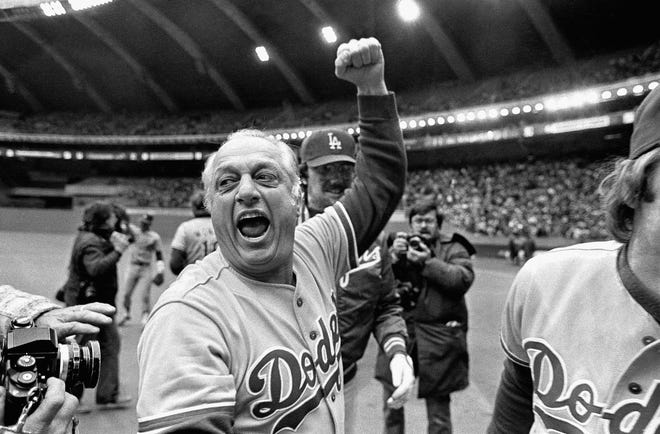 Tommy Lasorda celebrates in October 1981 after the Dodgers beat the Montreal Expos for the National League title in Montreal.