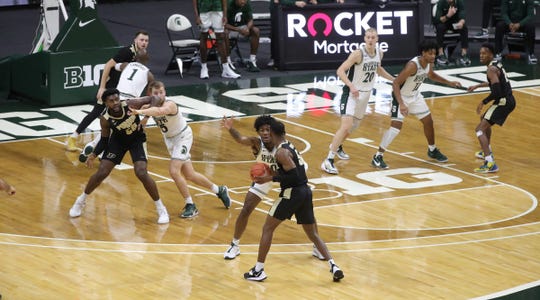 In the post, Michigan State Spartans forward Thomas Kithier defends Purdue Boilermakers forward Trevion Williams during the first half at Breslin Center in East Lansing, Friday, Jan. 8, 2021.