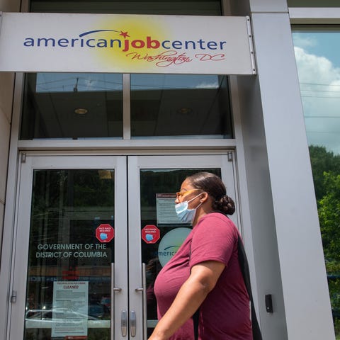 A woman walks past the the DC Department of Employ