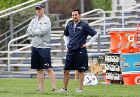 Dave Ziegler, right, stands with then Patriots director of college scouting Monti Ossenfort at a practice.