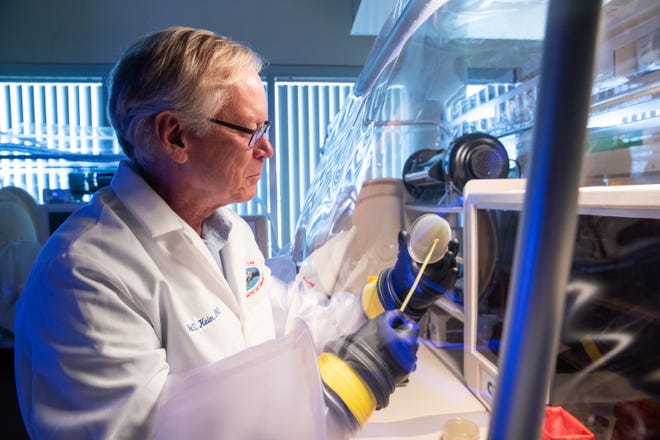 NAU microbiologist Paul Keim works in the lab.