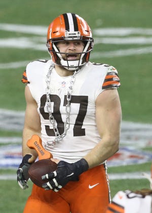 Defensive end Porter Gustin will be back with the Browns for the 2021 season after he was tendered as an exclusive rights free agent. [Charles LeClaire/USA TODAY Sports]