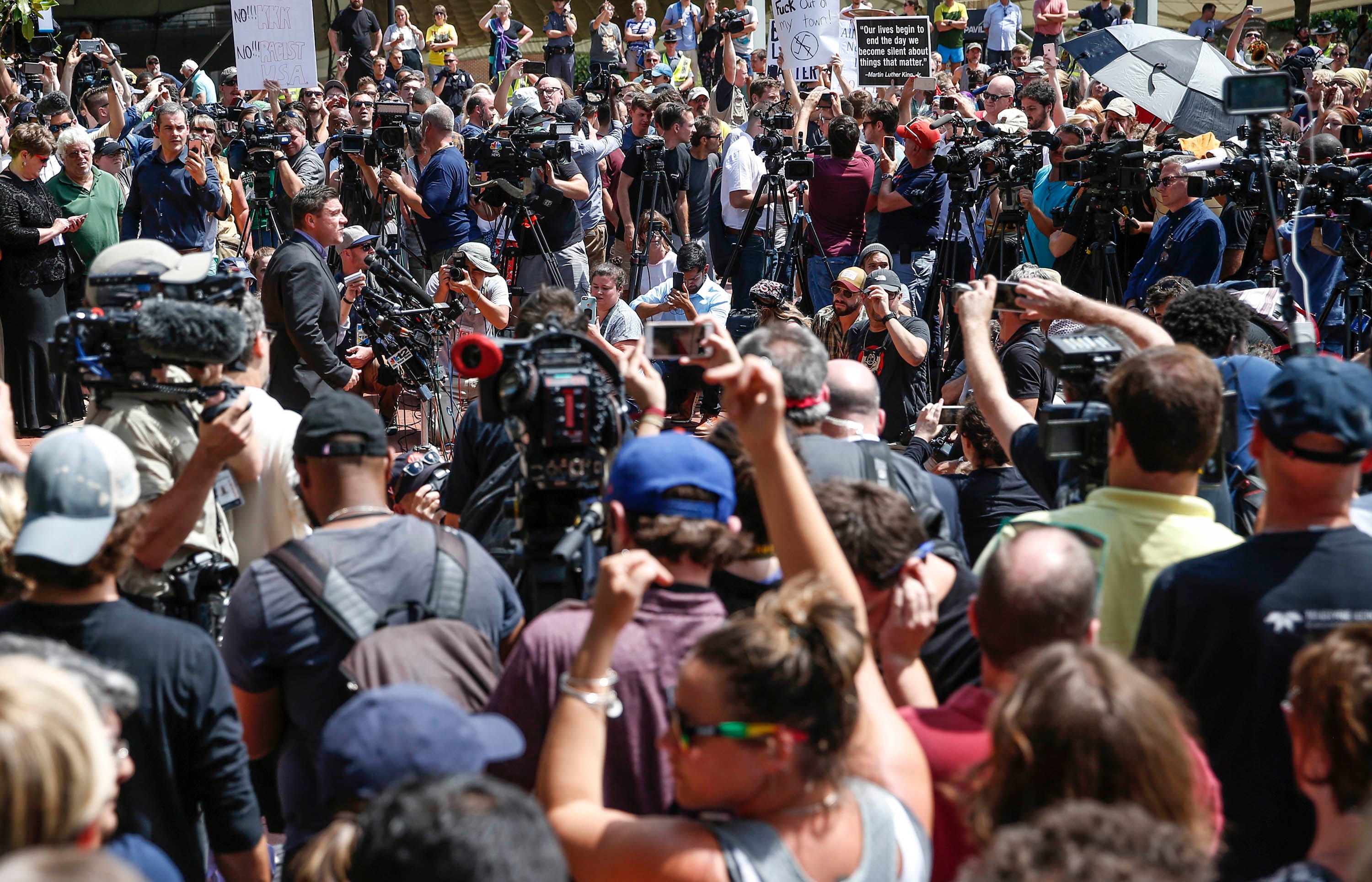 Aug 13, 2017; Charlottesville, VA, USA;  'Unite the Right' rally organizer and white nationalist Jason Kessler speaks to a large crowd gathered at Charlottesville City Hall. Crowd members played loud instruments and yelled as to drown out his voice. Mandatory Credit: Mykal McEldowney/IndyStar via USA TODAY NETWORK ORIG FILE ID:  20170813_lbm_usa_075.JPG