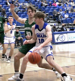 Buckeye Trail's Isaac Beaver (10) attempts to get around Malvern's Derk Hutchison (10) during Inter-Valley Conference action on Tuesday evening at Buckeye Trail High School.