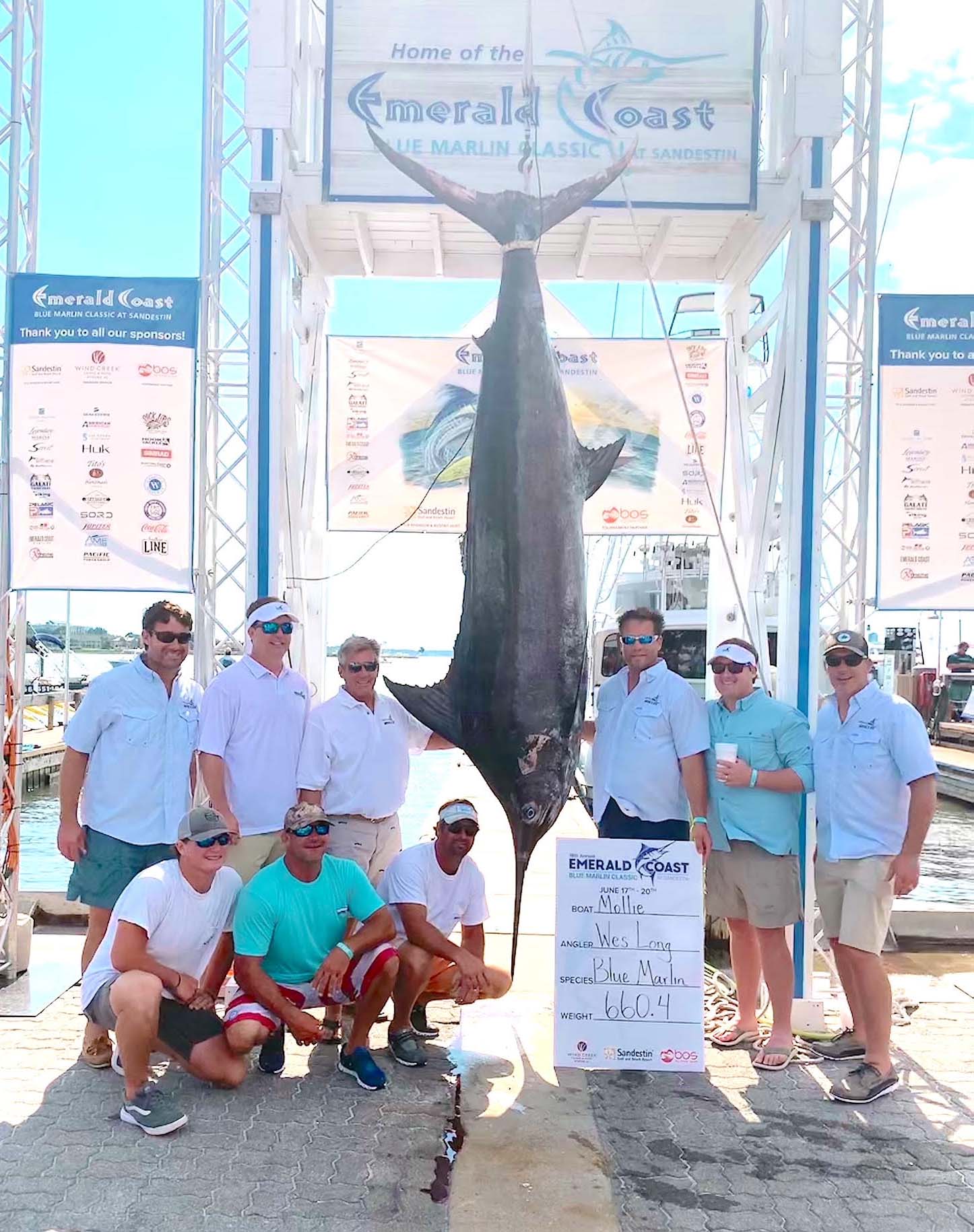 Capt. Jeff Shoults, standing just to the left of the big blue, is most proud of winning the hometown tournament. This was his first time to take first in the Emerald Coast Blue Marlin Classic at Sandestin.