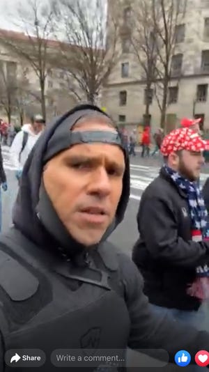 Mike St. Pierre appears in a still frame of a video he recorded himself and live-streamed to Facebook in Washington, D.C., on Jan. 6, 2021, where he said he was going to march to the Capitol and break in. St. Pierre was later recorded on video hurling an object into the building.