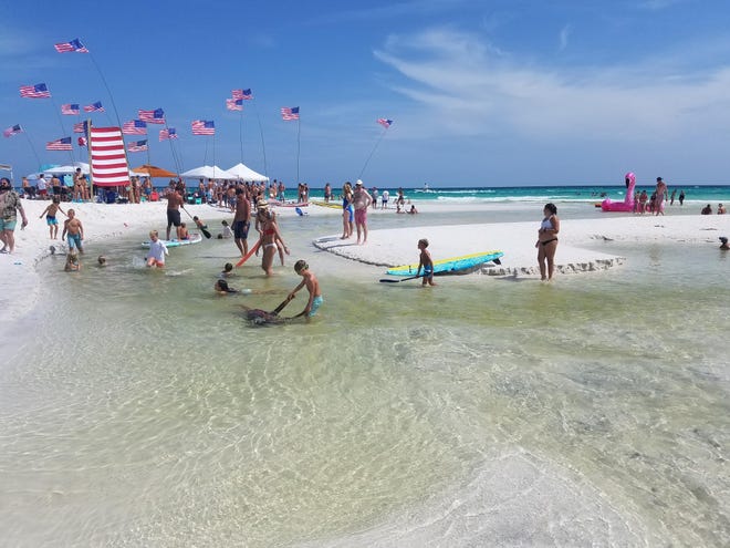 Crowds enjoy a Fourth of July holiday at Grayton Beach, a popular spot for tourists and locals alike along Walton County Road 30A. the county is moving to possibly acquire property for a public restroom to be located near the beach.