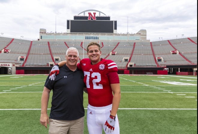 Matthew Anderson (72) poses with his father, Mark Anderson, during a June 2018 visit to Nebraska. The offensive lineman signed with the Cornhuskers but now is transferring to UL.