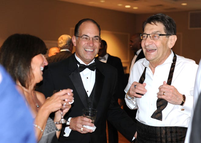 Fred Levin, right, has a laugh with John and Jerre Peacock during the 2011 Rat Pack Reunion fundraiser for the Council on Aging of West Florida at New World Landing.