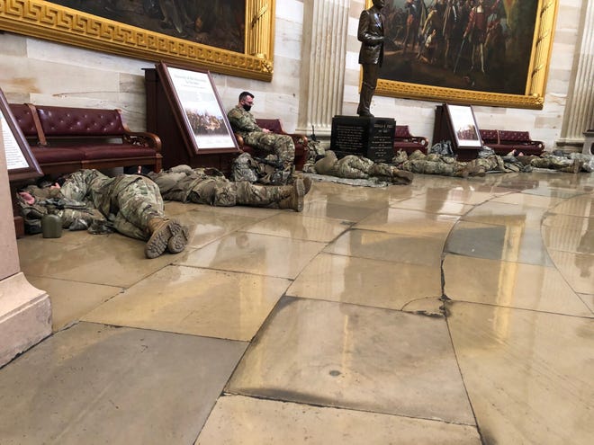 More Guard members sleep on the Capitol floor Wednesday before Congress proceeds with impeachment hearings.