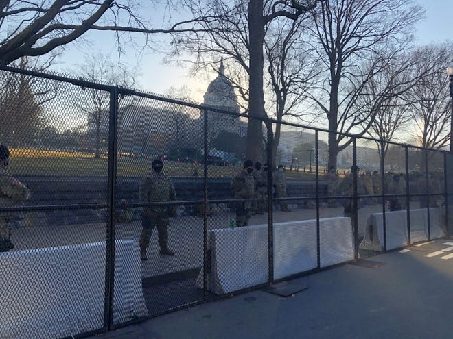 National Guard members stand outside the U.S. Capitol on Jan. 13.