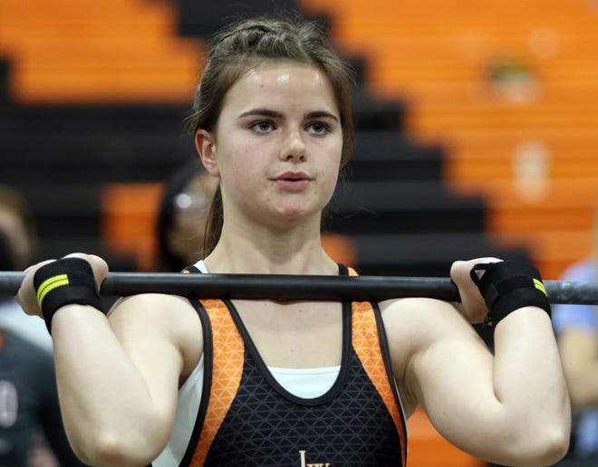Lake Wales’ Danielle Garrison pauses before finishing her lift in the clean and jerk. She went on to win the 154-pound weight class on last year at the Class 1A, District 13 district meet.