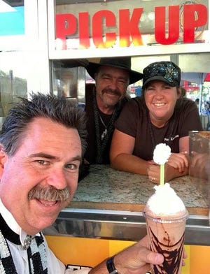 Stacy and Silas Doane of Yreka (back) serve up a coffee beverage to their friend, magician Frank Thurston. The couple opened their mobile café Pony Espresso in Yreka in September 2020 after the COVID-19 pandemic canceled their traveling business plans.