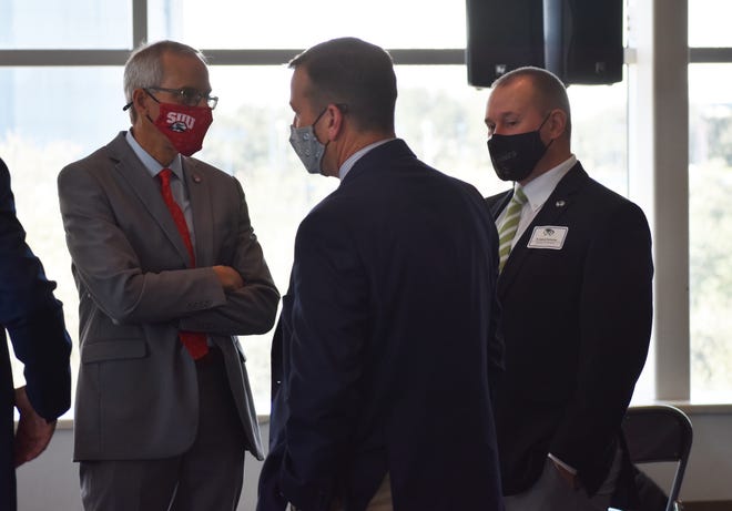 SUU president Scott Wyatt (left), DSU President Biff Williams (center) and UVU AD Jared Sumsion chat prior to the WAC's inductory conference.