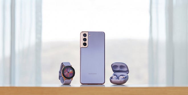 The Samsung Galaxy S21+ smartphone, which starts at $999.99 and is available for pre-order Thursday, shown here with Galaxy smartwatch and new Galaxy Buds Pro ($199.99). The S21+ will be available in a new color, Phantom Violet, as well as Phantom Silver, Phantom Black, and (on Samsung.com) Phantom Gold and Phantom Red.