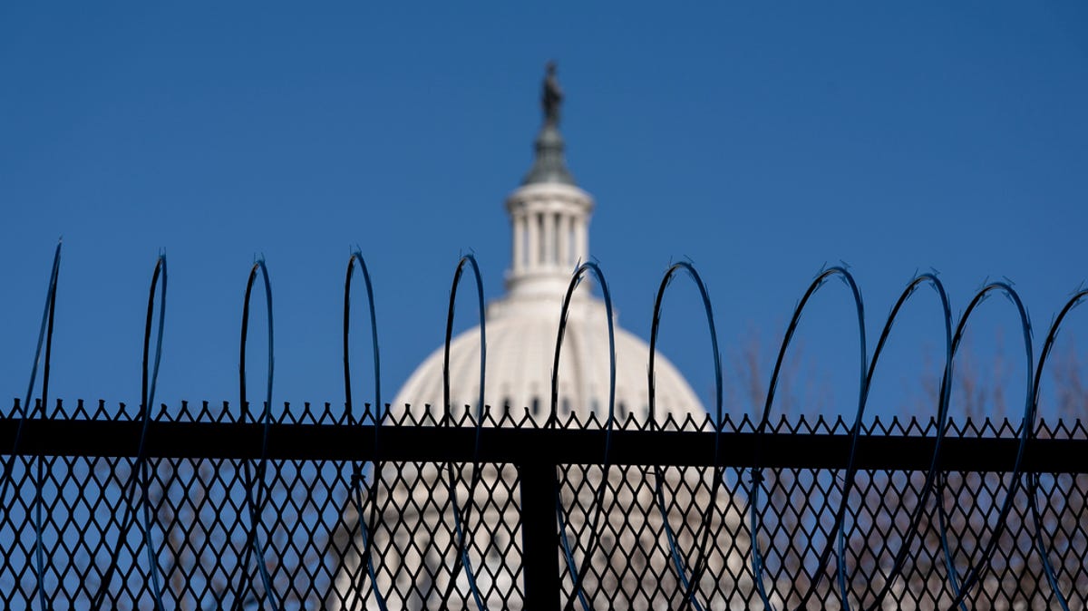Barbed wire is installed on security fencing surrounding the U.S. Capitol on January 14, 2021 in Washington, D.C.