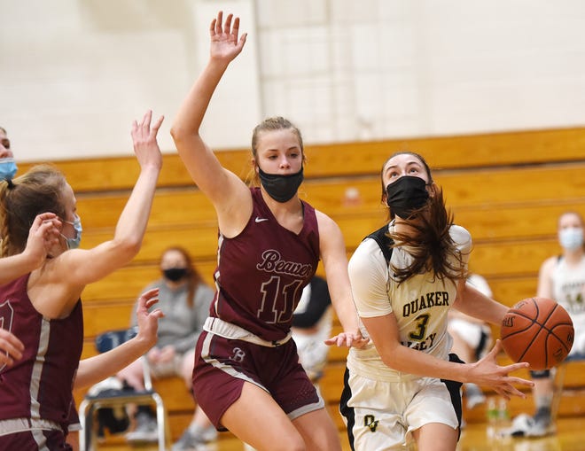 Beaver's Maddi Weiland and Kenzie Weiland (11) defend Quaker Valley's Bailey Garbee during Thursday night's game at Quaker Valley.