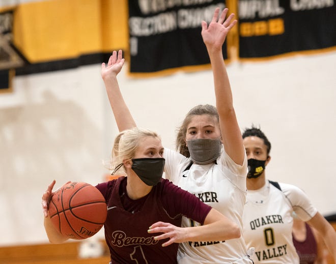 Beaver's Emma Pavelek drives to the hoop as Quaker Valley's Nora Johns defends during Thursday night's game at Quaker Valley. Beaver won the game 40-37.