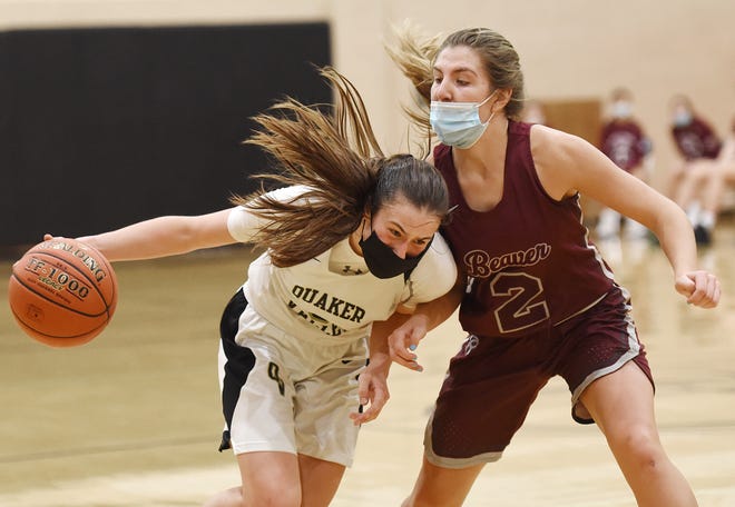 Quaker Valley's Bailey Garbee drives to the hoop as Beaver's Anna Blum defends during Thursday night's game at Quaker Valley.