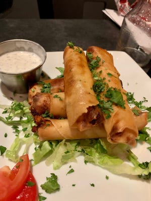 When visiting Flames Mediterranean Bar & Grille, don't miss a chance to try the crispy, delicious cheese rolls.