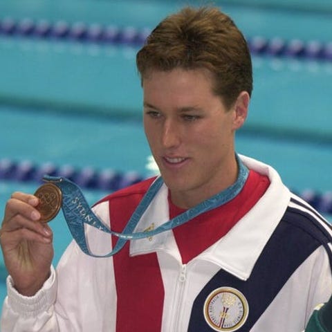 Klete Keller shows off his bronze medal in the men