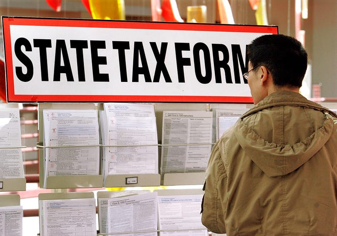 A man picks out tax forms at the Illinois Department of Revenue in Springfield on April 14, 2008.