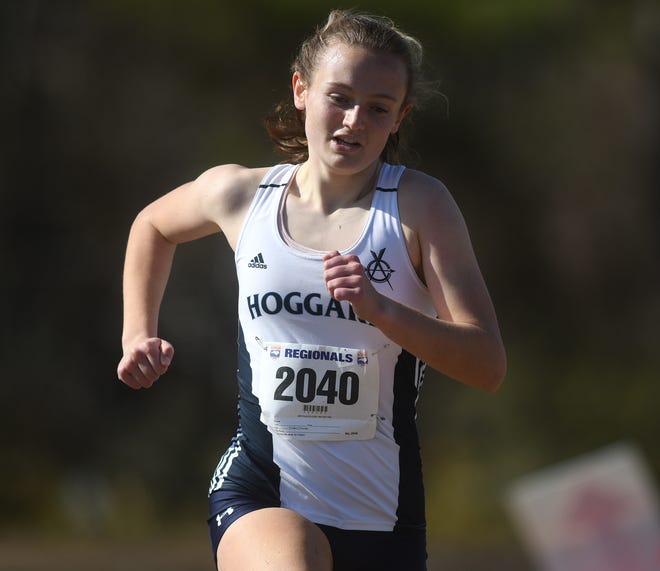 Hoggard's Molly Parker runs towards the finish line as the winner during the NCHSAA 4A East Regional Cross Country meet at Olsen Park in Wilmington, N.C., Saturday, January 16, 2021. Runners from Hoggard, Ashley and Laney had runners in the event along with fourteen other schools from Eastern North Carolina. Hoggard won both the girls and boys team event.    [MATT BORN/STARNEWS]